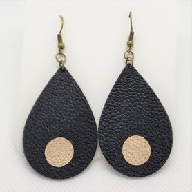 Black teardrop shaped faux leather earrings with champagne gold dots