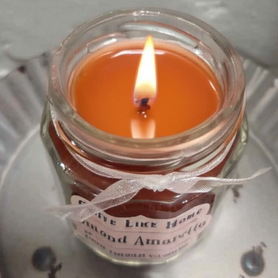Almond Amaretto scented 4oz. jar candle w/ gold lid, & organza ribbon