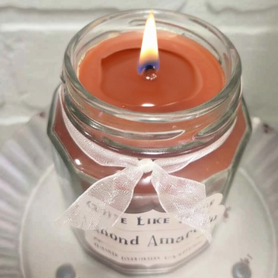 Almond Amaretto scented 6.5 oz. jar candle with gold lid, and organza ribbon