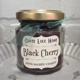 Black Cherry scented 4 oz. jar candle with gold lid, and organza ribbon.
