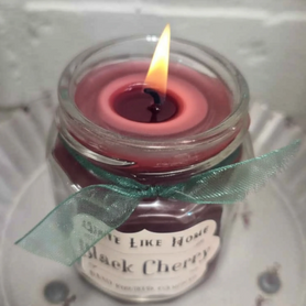 Black Cherry scented 4 oz. jar candle with gold lid, and organza ribbon.
