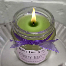 Candy Berry scented 4 oz. jar candle with gold lid, and organza ribbon.