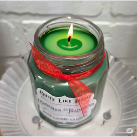 Christmas Traditions scented 6.5 oz. jar candle with gold lid, & organza ribbon.