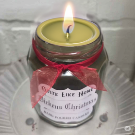 Dickens Christmas scented 6.5 oz. jar candle with gold lid, & organza ribbon.