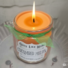 Cucumber Melon scented 4 oz. jar candle with gold lid and organza ribbon.