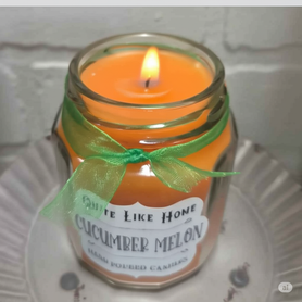 Cucumber Melon scented 6.5 oz. jar candle with gold lid and organza ribbon.