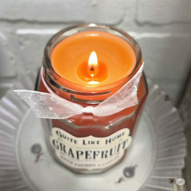 Grapefruit scented 6.5 oz. jar candle with gold lid and organza ribbon