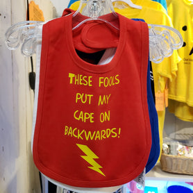 These fools put my cape on backwards bib. Baby humor, superhero, caped crusader, baby boss, funny