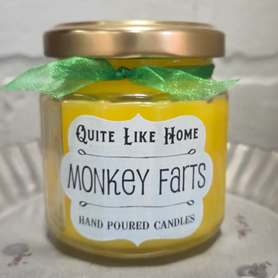 Monkey Farts scented 4 oz. jar candle with gold lid, and organza ribbon