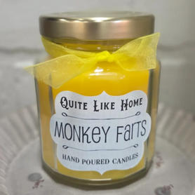 Monkey Farts scented 6.5 oz. jar candle with gold lid, and organza ribbon.