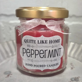 Peppermint scented 4 oz. jar candle with gold lid, and organza ribbon.