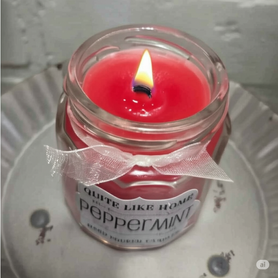 Peppermint scented 4 oz. jar candle with gold lid, and organza ribbon.