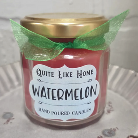 Watermelon scented 4 oz. jar candle with gold lid, and organza ribbon.