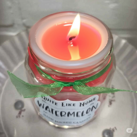 Watermelon scented 4 oz. jar candle with gold lid, and organza ribbon.