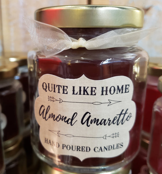 Almond Amaretto scented 6.5 oz. jar candle with gold lid, and organza ribbon