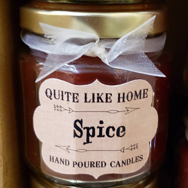 Spice scented 4 oz. jar candle with gold lid, and organza ribbon.