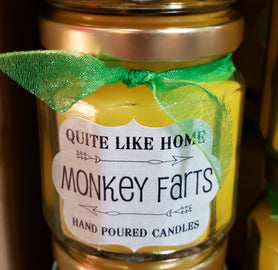 Monkey Farts scented 4 oz. jar candle with gold lid, and organza ribbon