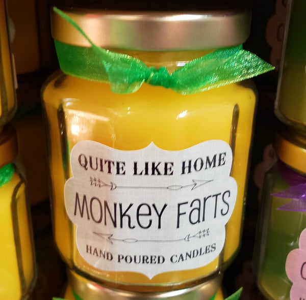 Monkey Farts scented 6.5 oz. jar candle with gold lid, and organza ribbon.