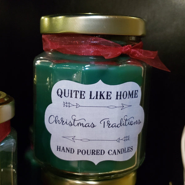 Christmas Traditions scented 6.5 oz. jar candle with gold lid, & organza ribbon.