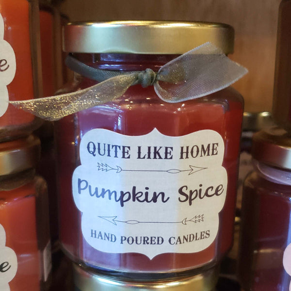 Pumpkin Spice scented 6.5 oz. jar candle with gold lid, and organza ribbon.