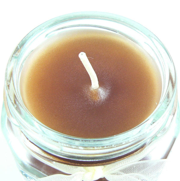 Creme Brulee scented 6.5 oz. jar candle with gold lid, and organza ribbon.