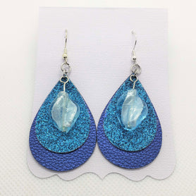 Triple stacked blue, turquoise, & ice blue teardrop shaped faux leather earrings
