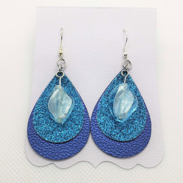 Triple stacked blue, turquoise, & ice blue teardrop shaped faux leather earrings